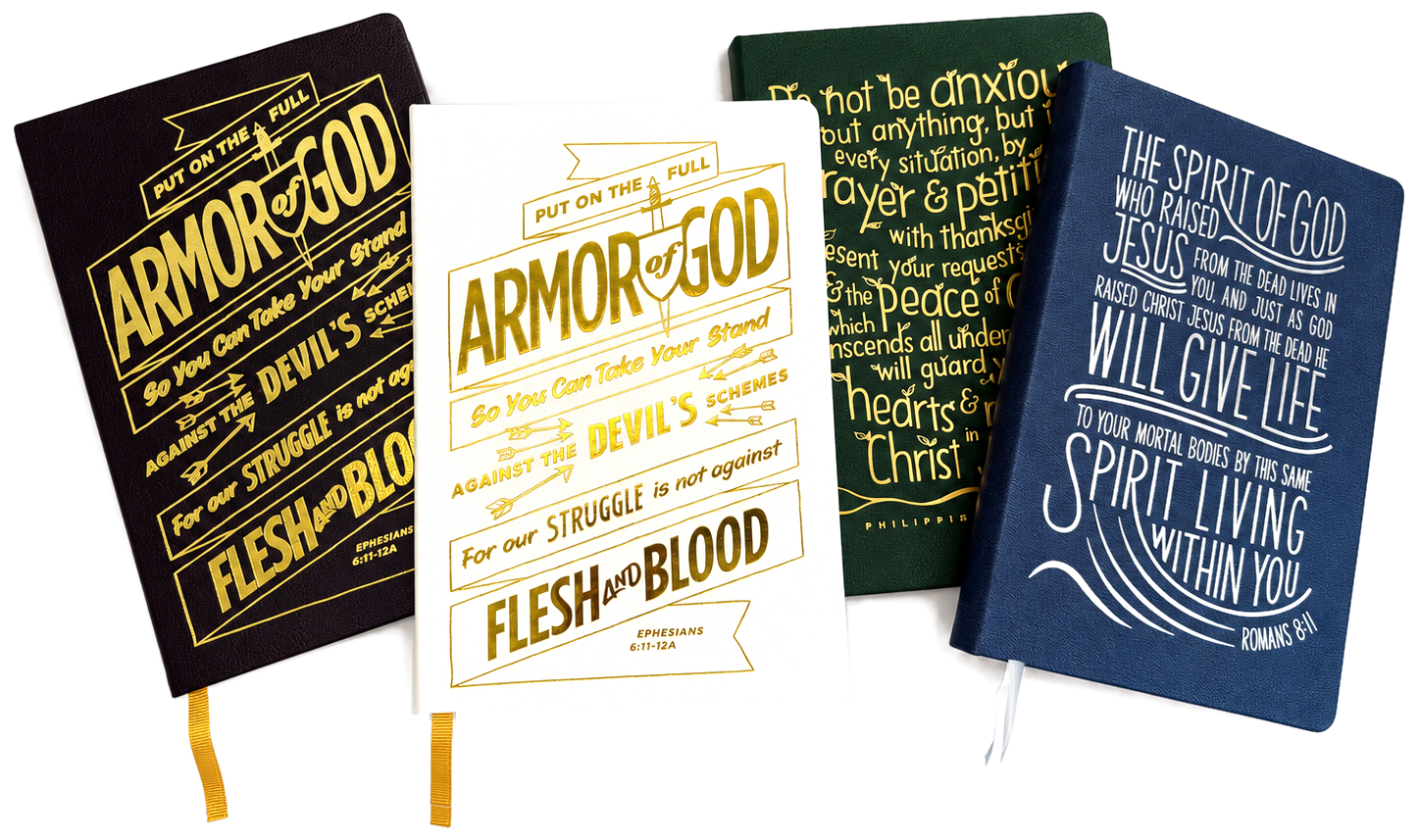 Four Gospelis journals: Full Armor of God in black and white, Peace in green, and Spirit in navy blue with a silver bookmark