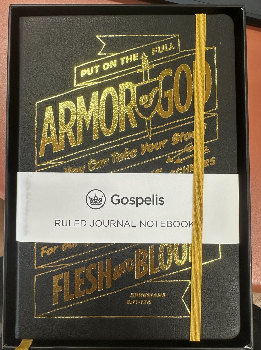 Gospelis journal with paper wrap band showing the logo and name